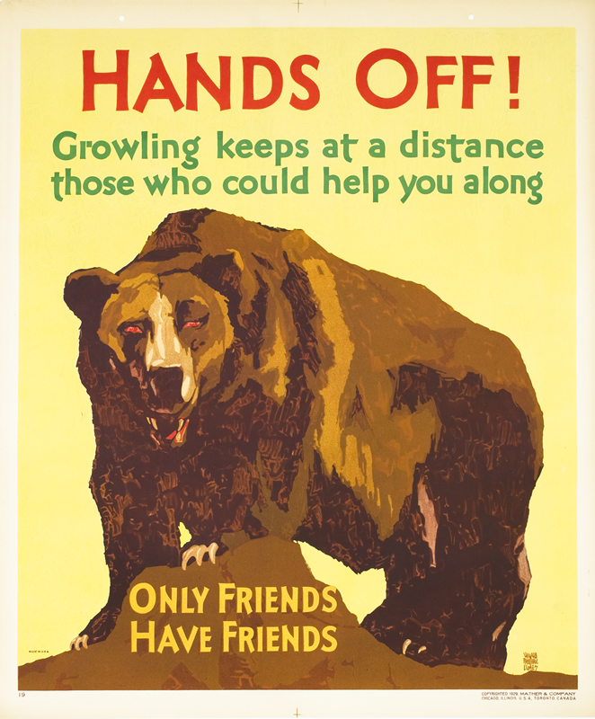 Bear atop rock growls fiercely; brown, yellow, red