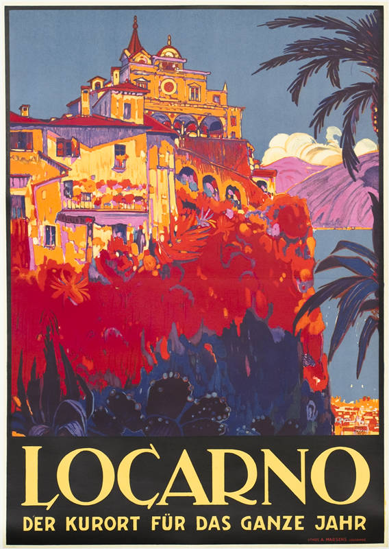 Buildings on cliff bathed in sunset colors amidst tropical plants; red, orange, blue