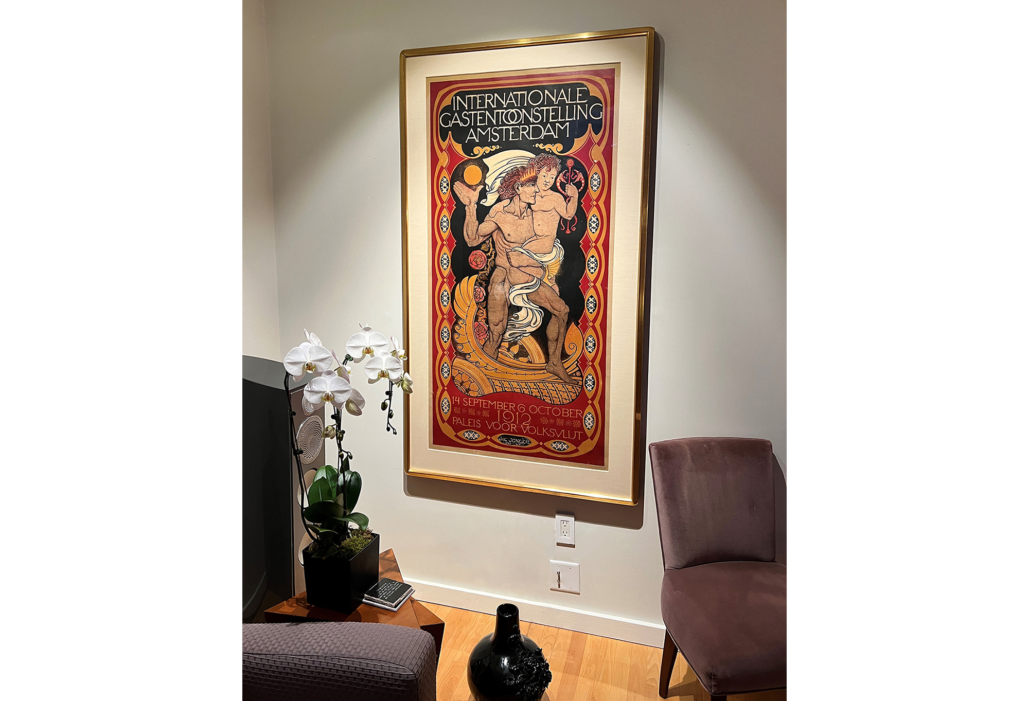 dutch poster with black vase, white orchid, brown chairs and speaker